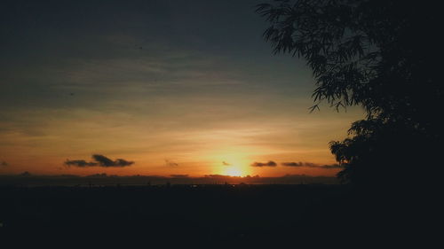 Scenic view of beach against sky during sunset