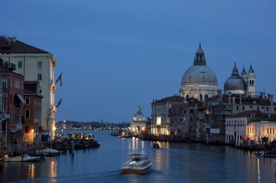 Illuminated buildings at waterfront