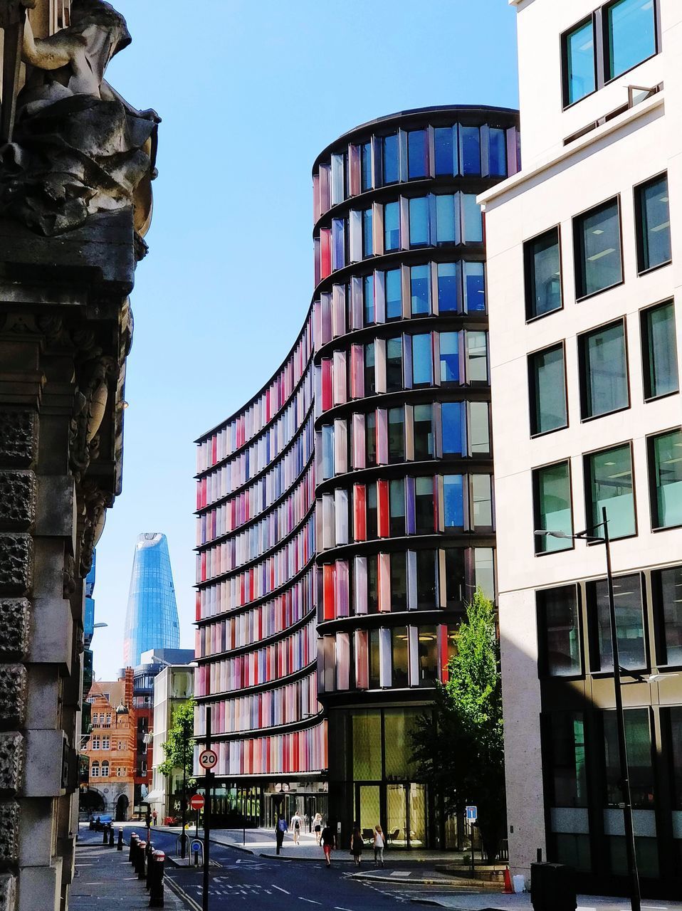 LOW ANGLE VIEW OF MODERN BUILDINGS AGAINST CLEAR SKY