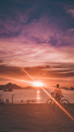 Scenic view of beach against sky during sunset