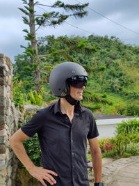 Side view of man standing on field