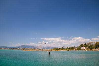 Landing approach of an airplane to corfu airport with a beautiful panoramic landscape, greece