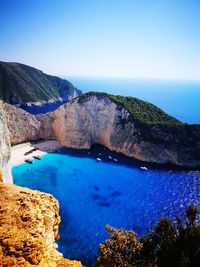 Scenic view of sea against clear blue sky