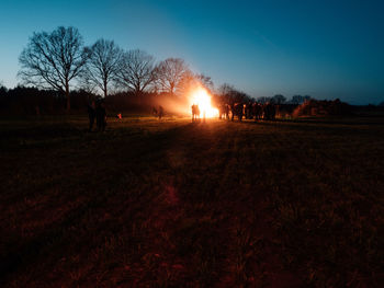 Scenic view of field against sky during sunset