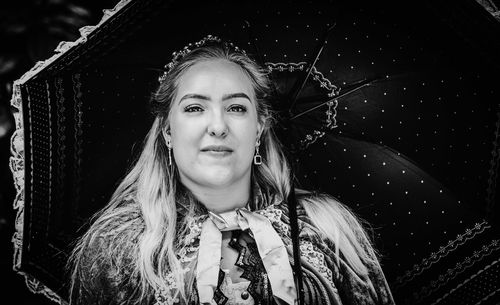 Beautiful girl under an umbrella in black and white