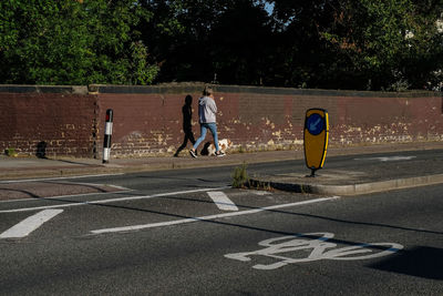 People walking on road in city