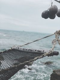 Close-up of fishing net on beach