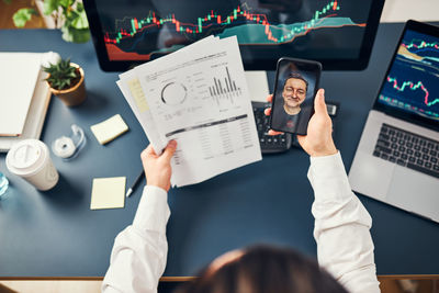 High angle view of woman using digital tablet