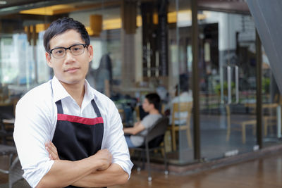 Portrait of young man standing outdoors