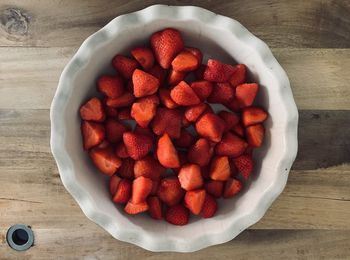 High angle view of strawberries in bowl on table