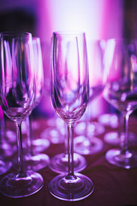 Close-up of wine glasses on table