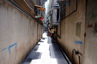 Walkway amidst buildings