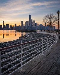City at waterfront during sunset