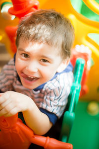 Portrait of happy boy playing