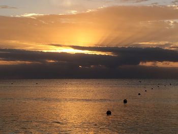 Scenic view of sea at sunset