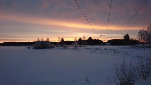 Scenic view of landscape against sky during sunset