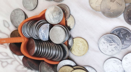 High angle view of coins on table