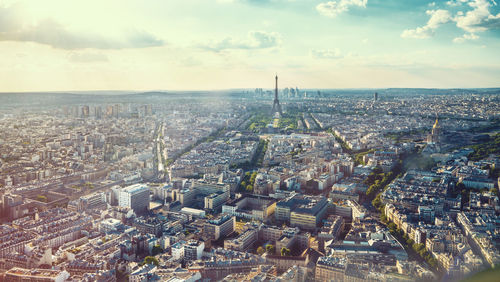 High angle view of city against cloudy sky