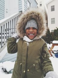 Smiling boy wearing warm clothing during winter