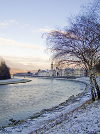 Scenic view of river against sky during winter