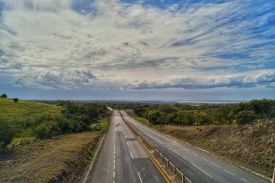 Road amidst landscape against sky