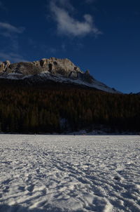 Scenic view of frozen lake against sky