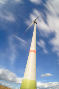 Low angle view of windmill against sky