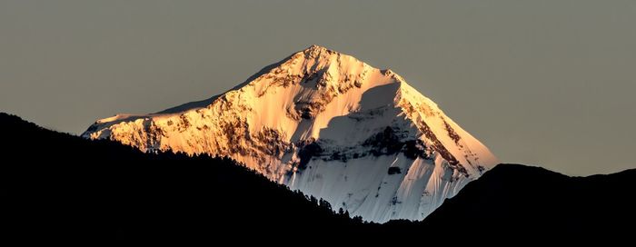 Panoramic view of silhouette mountains against sky during sunset