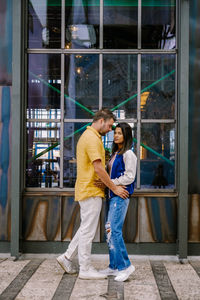 Man and woman standing at home