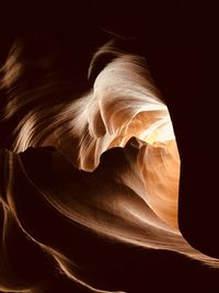 Close-up of rock formation against black background