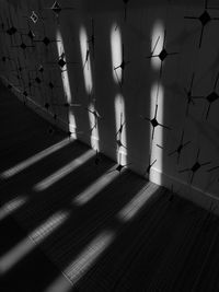 Low angle view of sunlight falling on wall