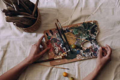 Cropped hand of person working on table