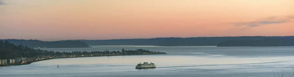 Panoramic view of sea against sky during sunset