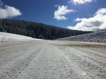 Scenic view of landscape against sky during winter