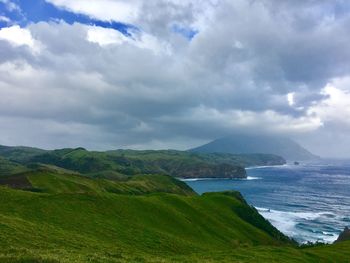 Scenic view of sea against cloudy sky