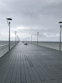 View of pier on sea against sky