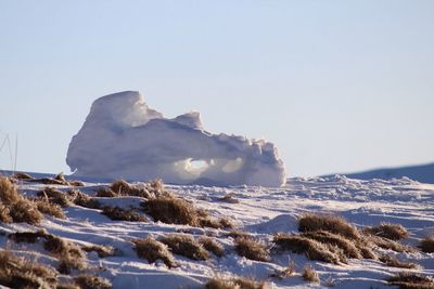 Scenic view of frozen sea against clear sky