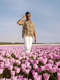 Portrait of man standing on field