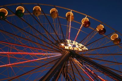 Low angle view of ferries wheel against clear sky