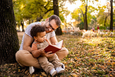 Young woman sitting on field