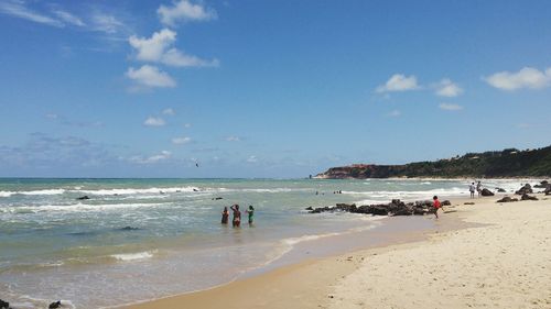 Scenic view of beach against blue sky