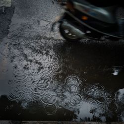 Reflection of car on puddle