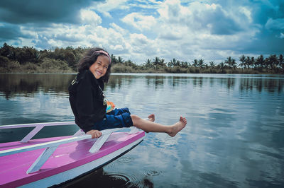 Portrait of woman kayaking in lake