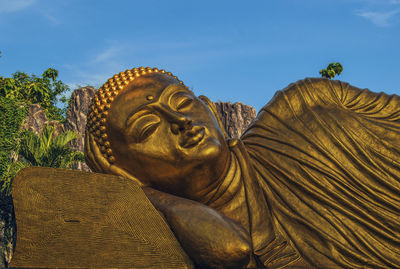 Low angle view of statue against sky