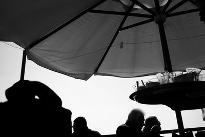 Low angle view of people against sky