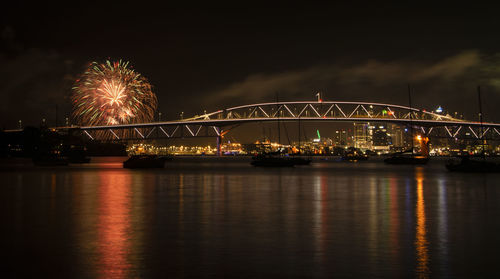 Illuminated ferris wheel at night