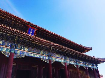 Low angle view of building against blue sky