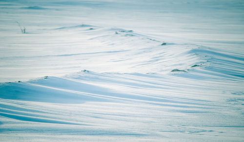 Aerial view of snow covered land