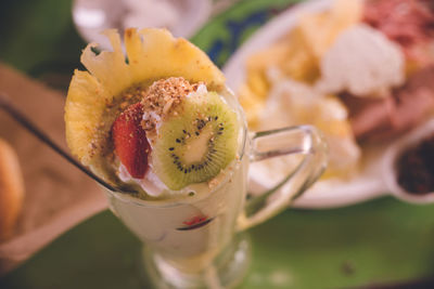 Avocado smoothie with fruit toppings at a diner in the old town of chefchaouen, morocco.