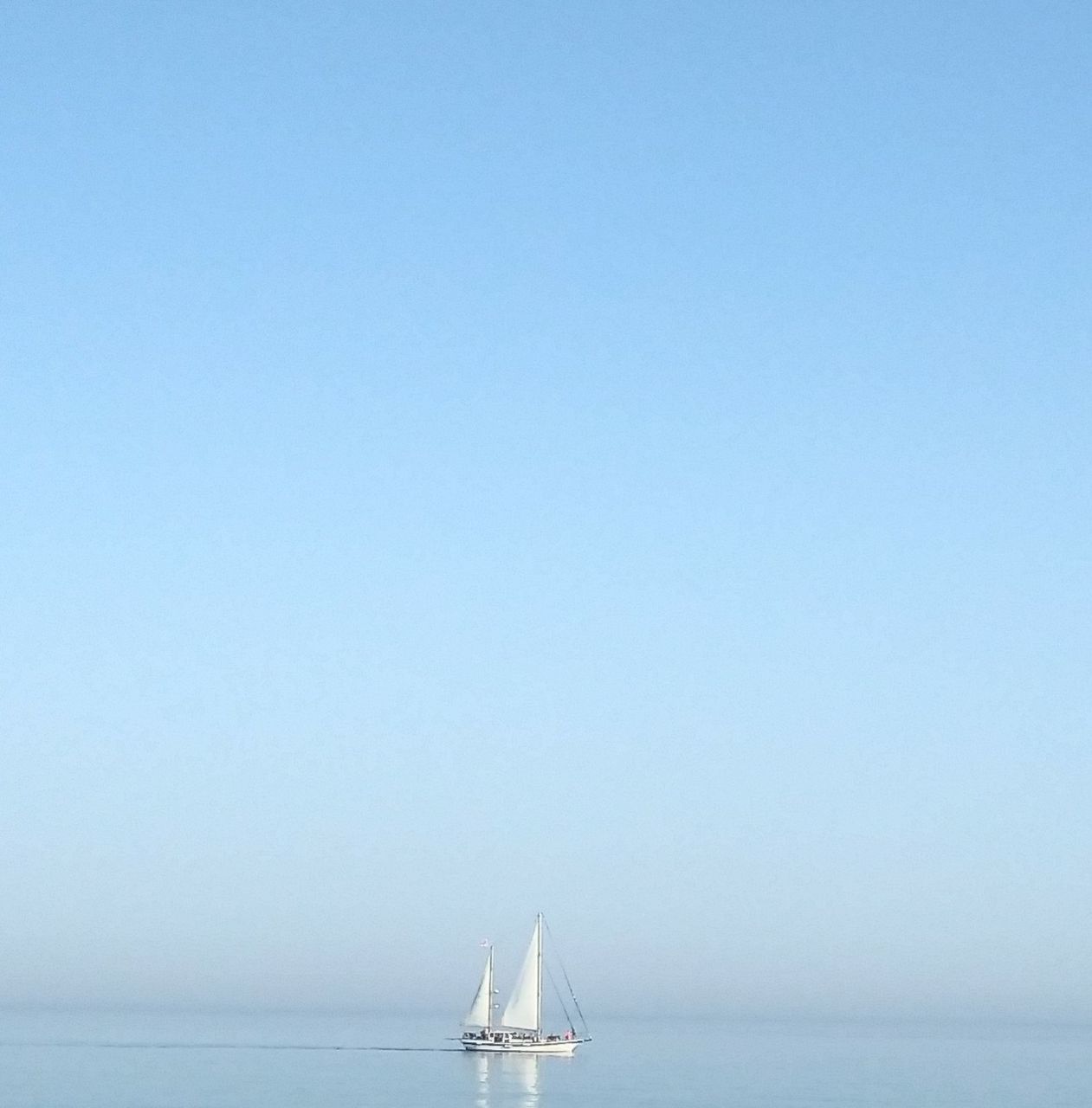 water, sea, sky, nautical vessel, copy space, transportation, mode of transportation, horizon over water, blue, clear sky, scenics - nature, sailboat, horizon, waterfront, beauty in nature, nature, sailing, no people, day, outdoors, yacht